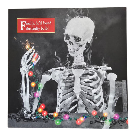 Open XmasSkeleton holding fairy lights